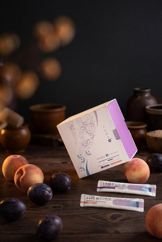 Kuro Kosen box with two sachets, styled with peaches and plums